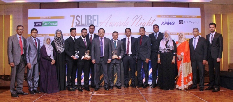 HNB Managing Director / CEO Jonathan Alles, Deputy General Manager, Corporate Banking, Ruwan Manatunga, Assistant General Manager, Islamic Banking Hisham Ally, Head of Project Finance, Majella Rodrigo with the staff of Islamic banking unit at the “Sri Lanka Islamic Banking and Finance Industry” (SLIBFI) awards ceremony.
